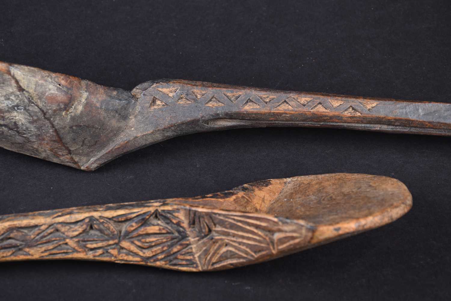 Two African carved wood spoons, each with geometric carved decoration, the smaller spoon carved to - Image 4 of 17