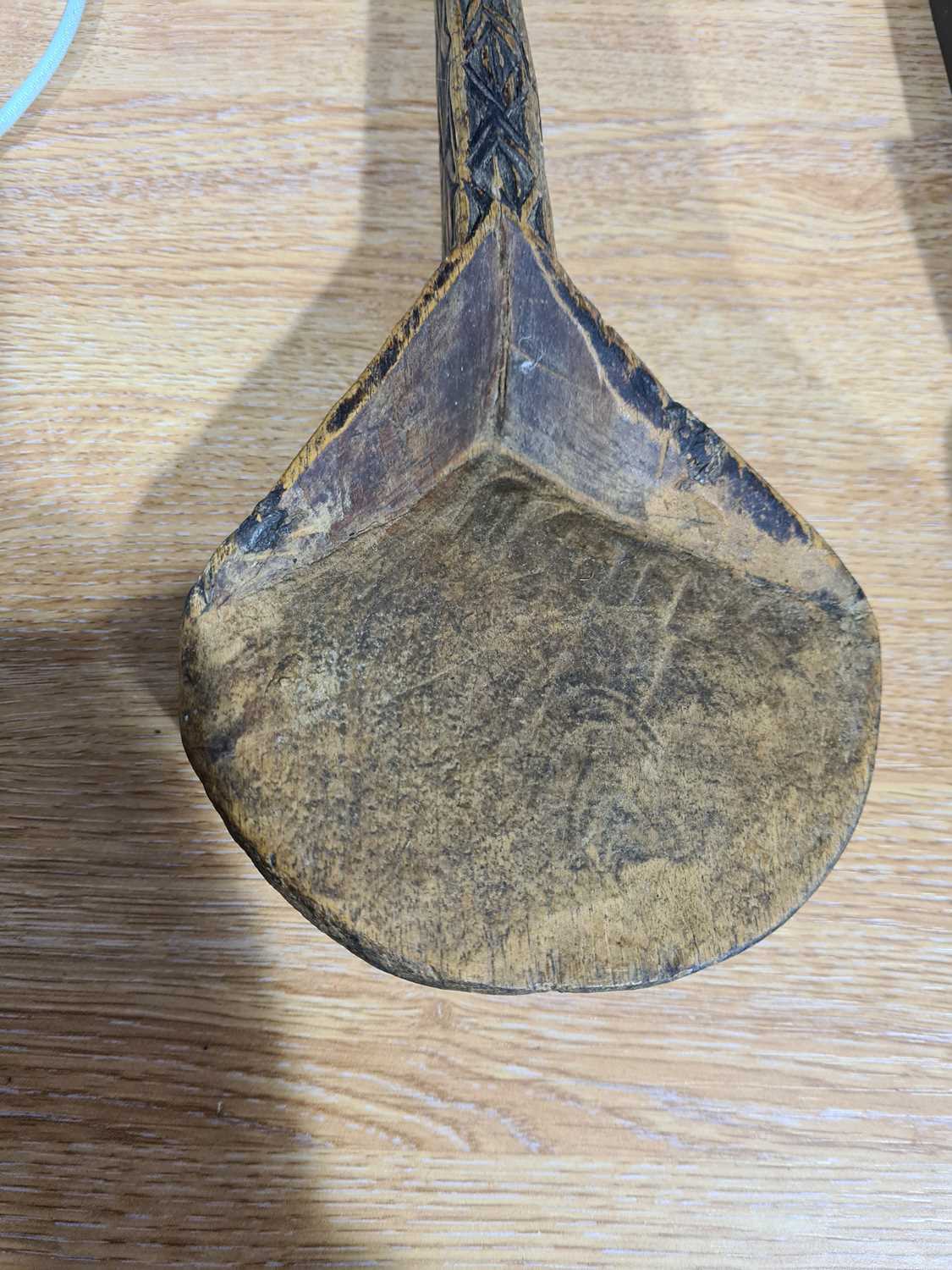 Two African carved wood spoons, each with geometric carved decoration, the smaller spoon carved to - Image 17 of 17