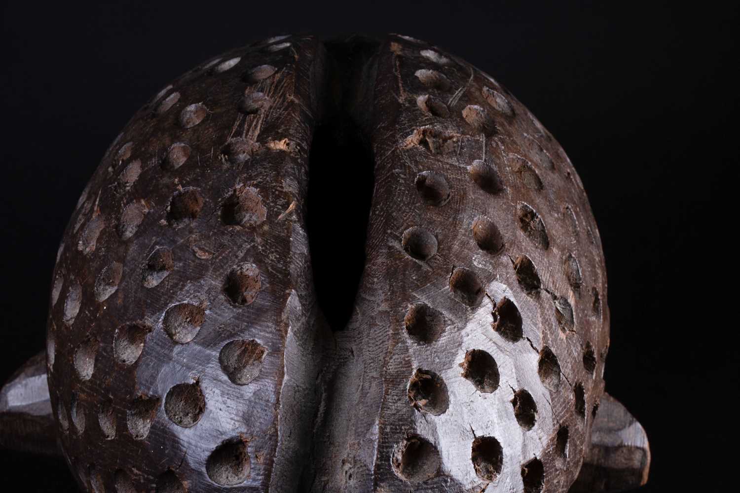 A Bamileke helmet mask, Cameroon, an elliptical opening to the crown of the elongated head, with - Image 3 of 7