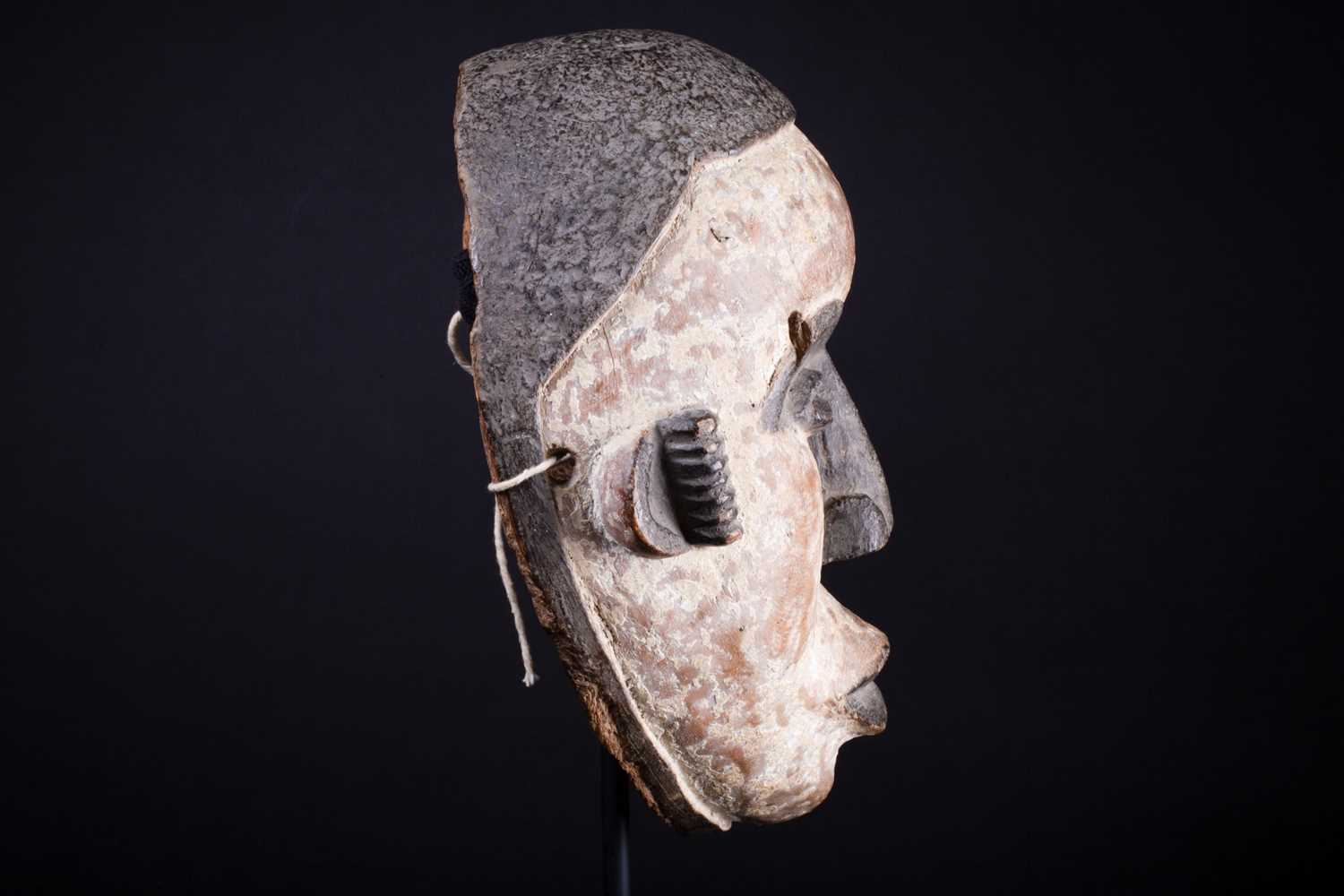 An Igbo mask, Nigeria, with short coiffure, highlighted in black against a white pigment ground, - Image 3 of 8