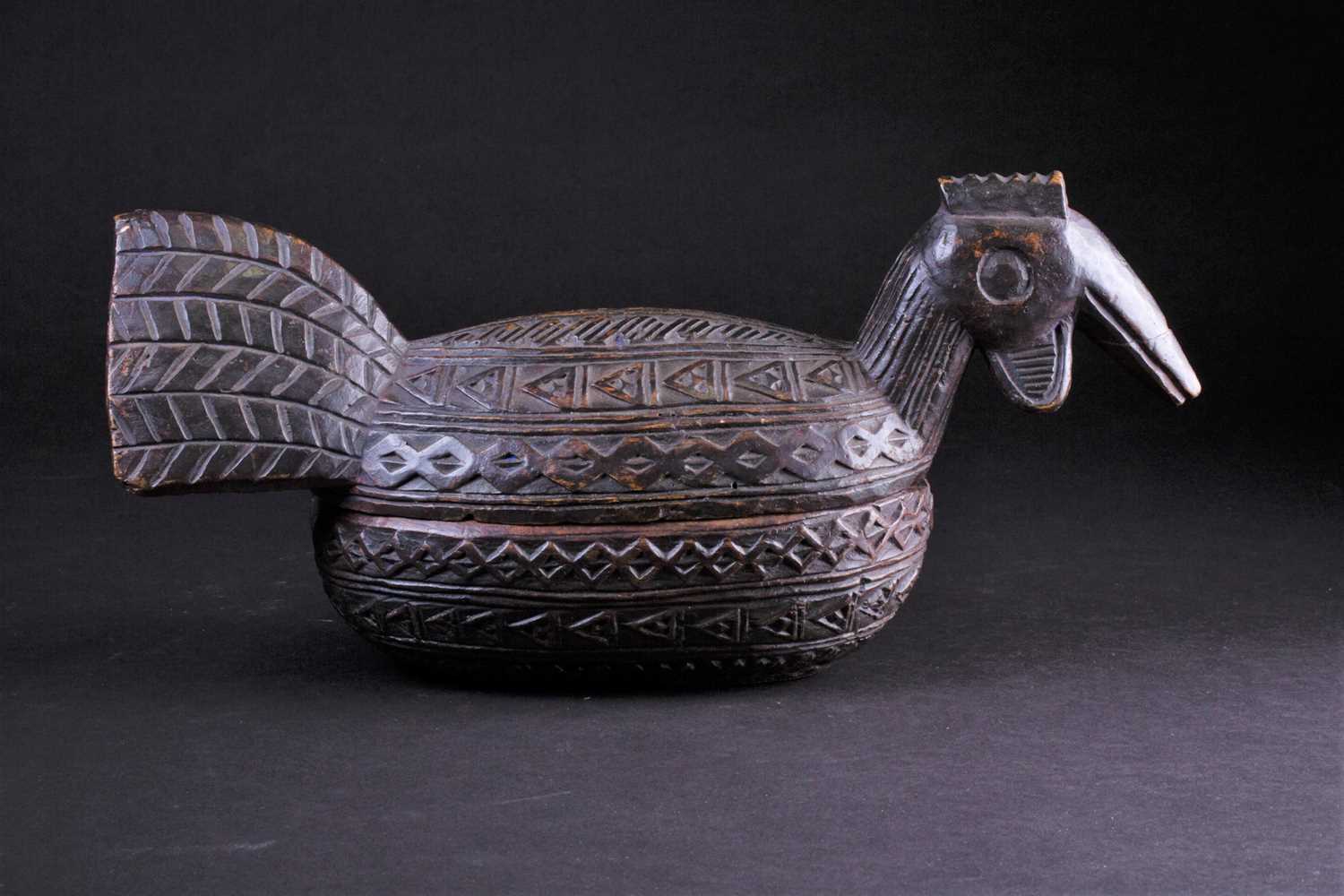 A Yoruba carved wood box in the form of a bird, Nigeria, with chip carved geometric band decoration, - Image 2 of 4