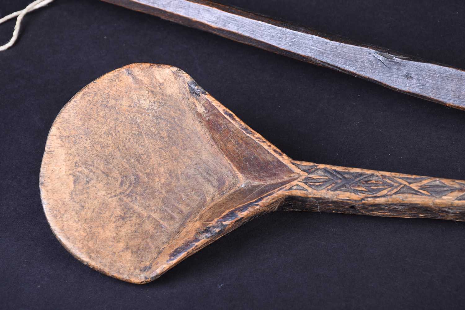 Two African carved wood spoons, each with geometric carved decoration, the smaller spoon carved to - Image 3 of 17