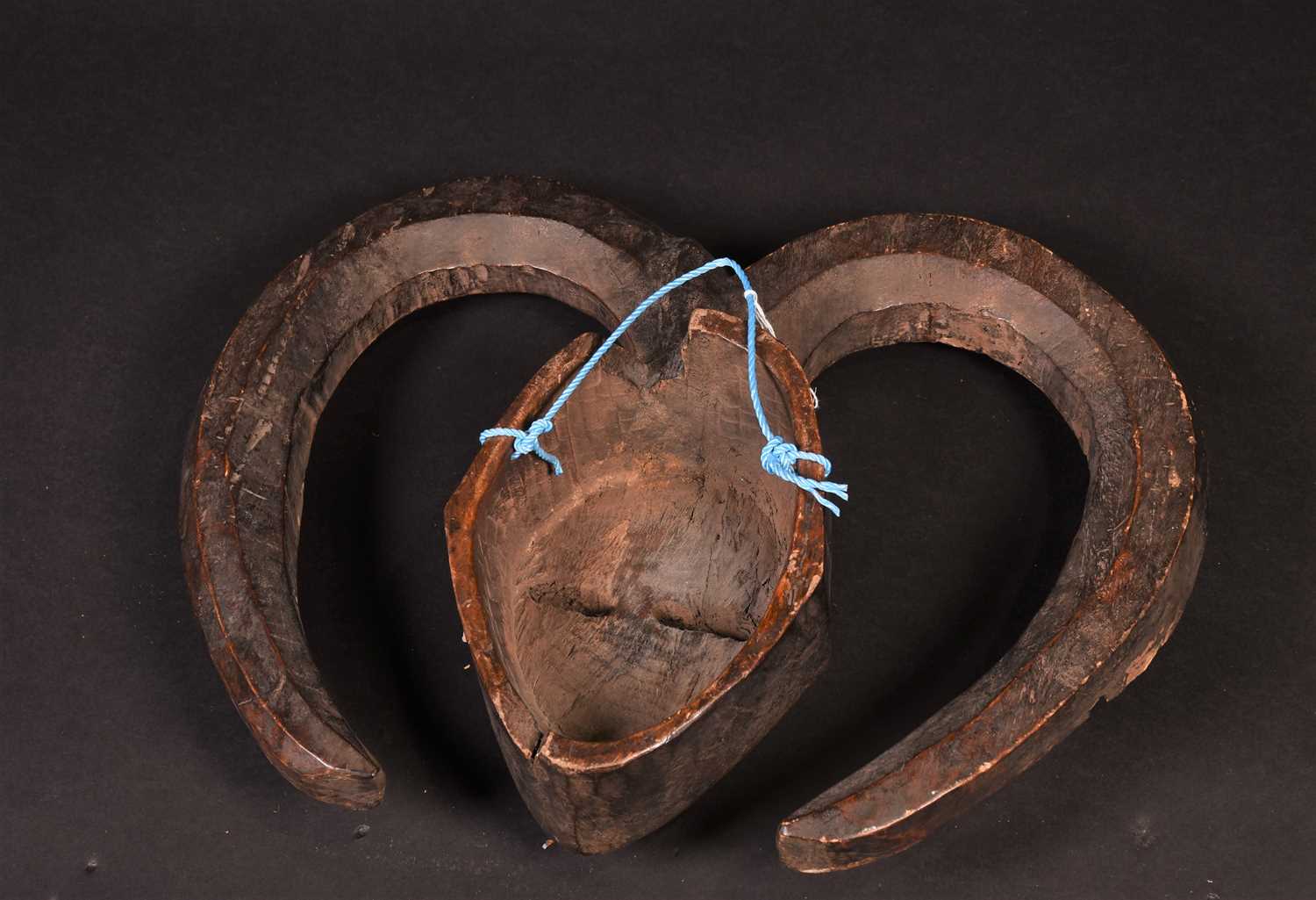 A Kwele mask, Gabon, the mask with narrow eye slits, a small mouth showing teeth and incised lines - Image 4 of 4