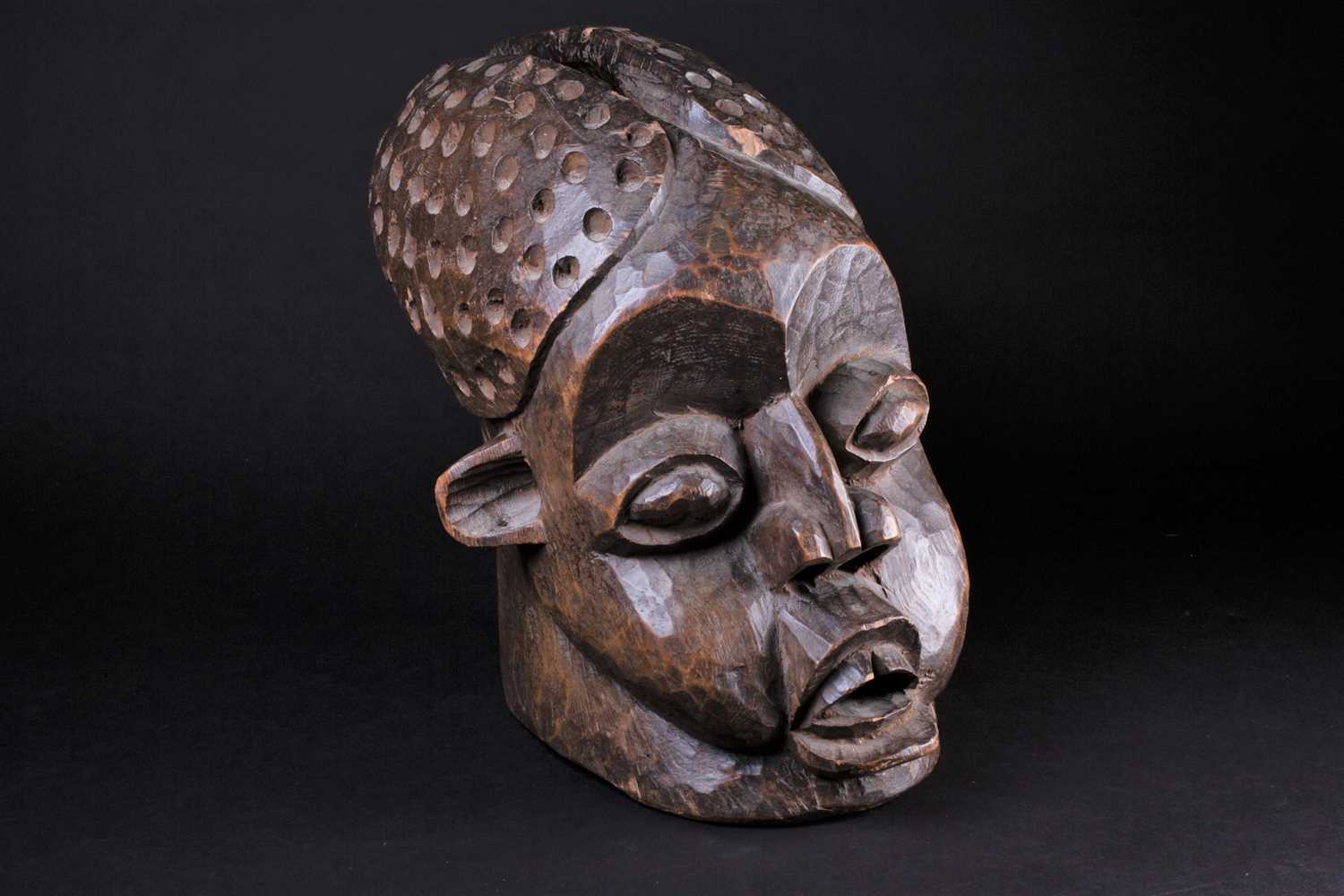 A Bamileke helmet mask, Cameroon, an elliptical opening to the crown of the elongated head, with - Image 2 of 7