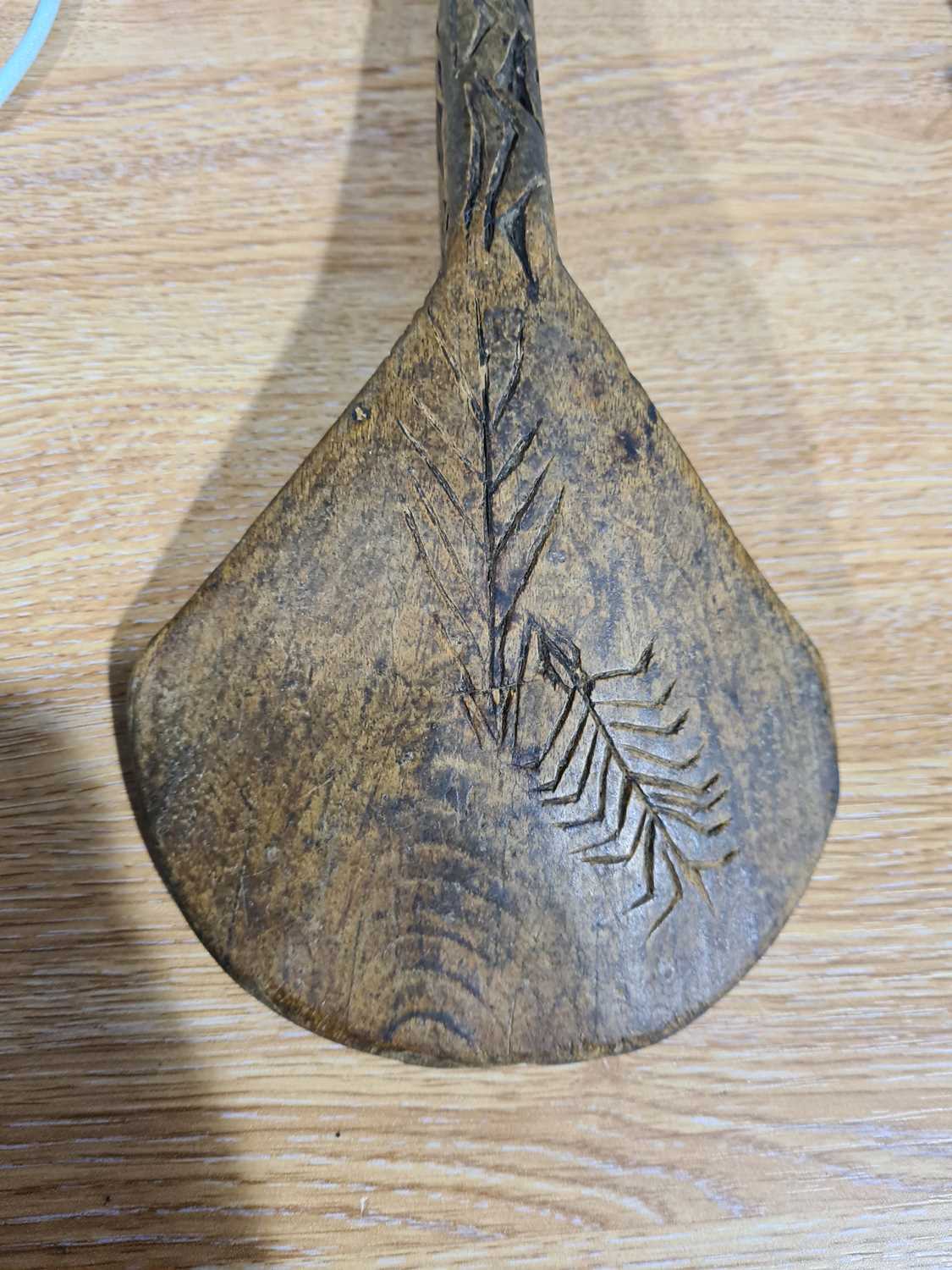 Two African carved wood spoons, each with geometric carved decoration, the smaller spoon carved to - Image 9 of 17