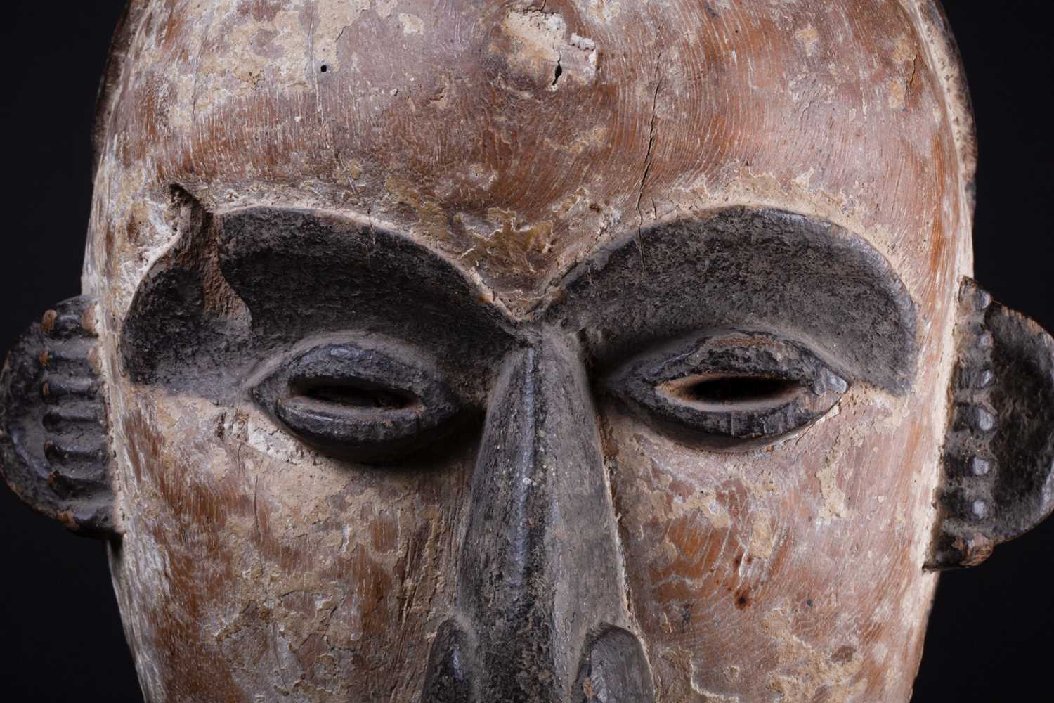 An Igbo mask, Nigeria, with short coiffure, highlighted in black against a white pigment ground, - Image 2 of 8