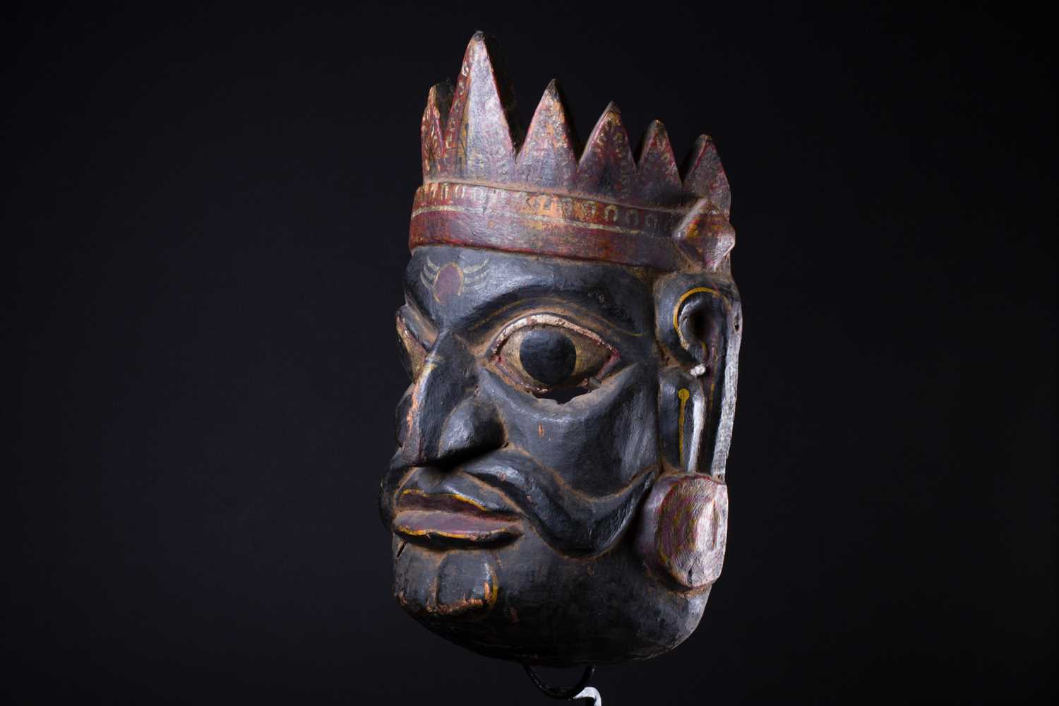 An Indonesian carved and painted ceremonial male mask, in yellow, red, white and black pigment, - Image 3 of 5