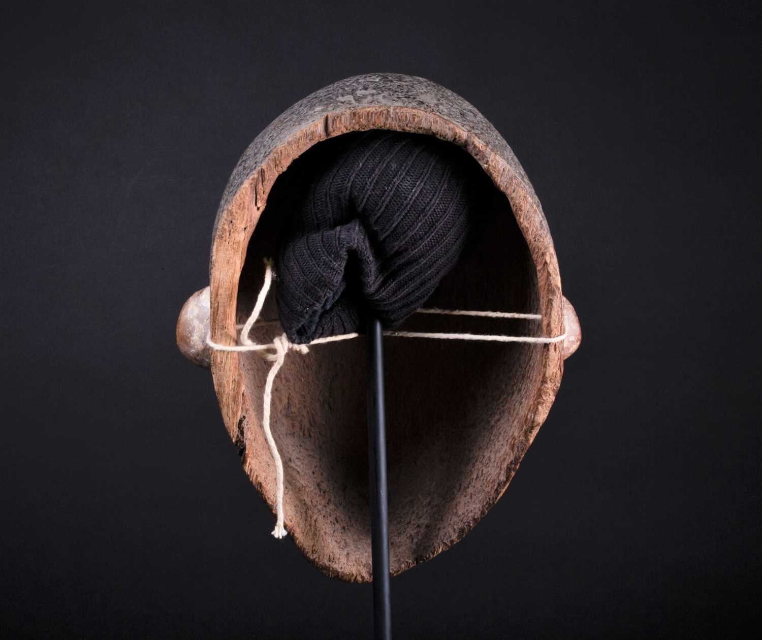 An Igbo mask, Nigeria, with short coiffure, highlighted in black against a white pigment ground, - Image 5 of 8