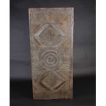 An Igbo carved wood door, Nigeria, the geometric decoration, 142cm x 63cmFootnote: From the