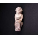 A carved stone Nomoli figure, Sierra Leone, with incised linear decoration, 17cmFootnote: From the