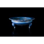A Chinese Qing dynasty copper blue glazed circular porcelain bowl with shaped and raised barbed