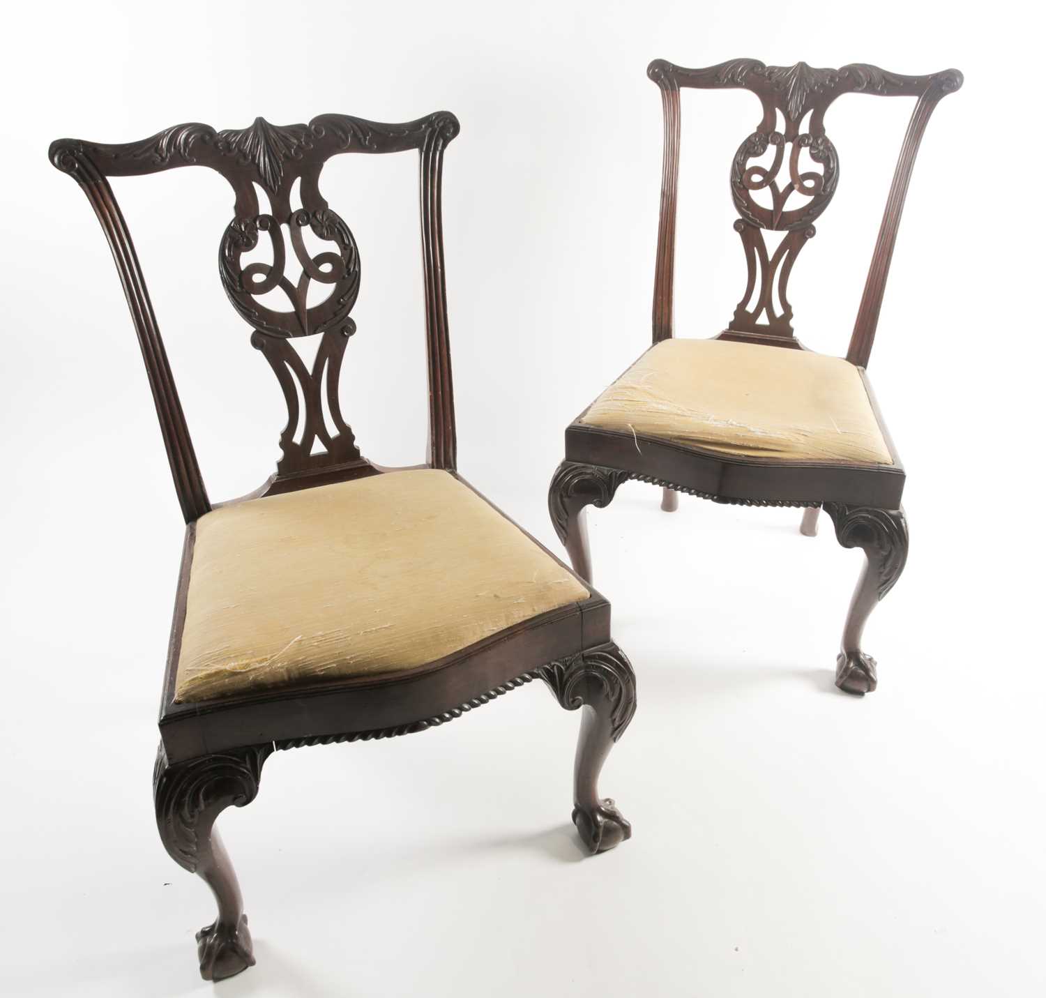 A pair of George III carved and pieced mahogany "Chippendale" style side chairs with bow-shaped