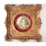 A 19th century Vienna style porcelain cabinet plate, mounted to a carved ornate giltwood frame,