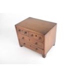 An Edwardian, mahogany apprentice, miniature chest of two short over two long drawers with