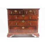A William & Mary figured walnut chest of Two short over Three long drawers. The crossbanded, quarter