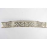 A George III serpentine brass fender with pierced and engraved Greek key, cornucopia, and urn