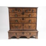 William & Mary walnut chest on stand. with crossbanded and quarter veneered top. Fitted two short