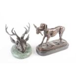 A bronze desk weight modelled as the head of a stag, mounted an oval green marble base, unsigned,