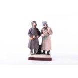 A late 19th century Russian Gardner Porcelain figure group, ‘Newly Arrived Peasants', depicting