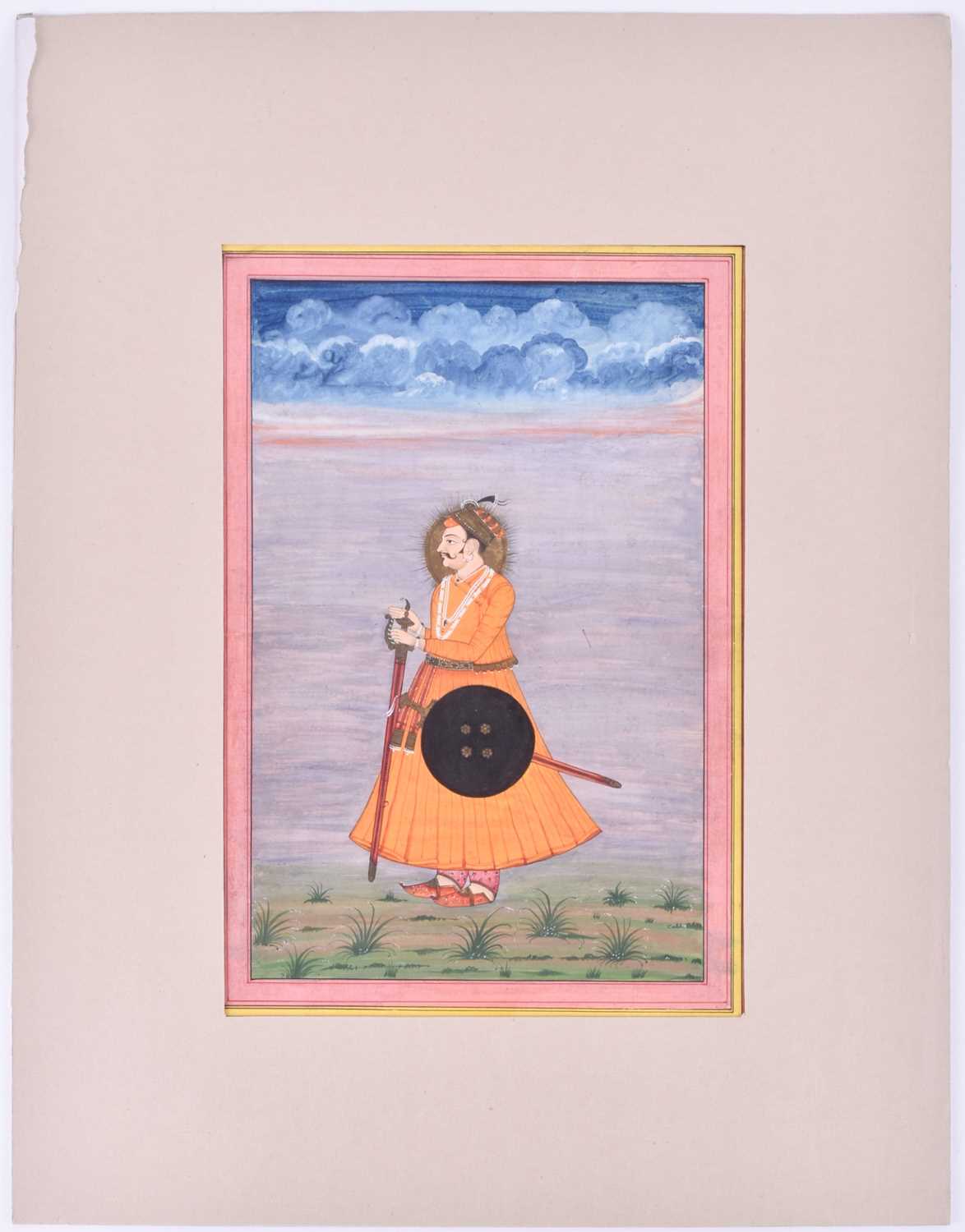 Indian School, 19th century, full length portrait of a Maharaja, with gilt nimbus, with sword and