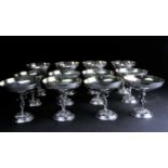 A set of eight Lambidis silver-plated coupes, each with figural and vine decorated stems, gilt