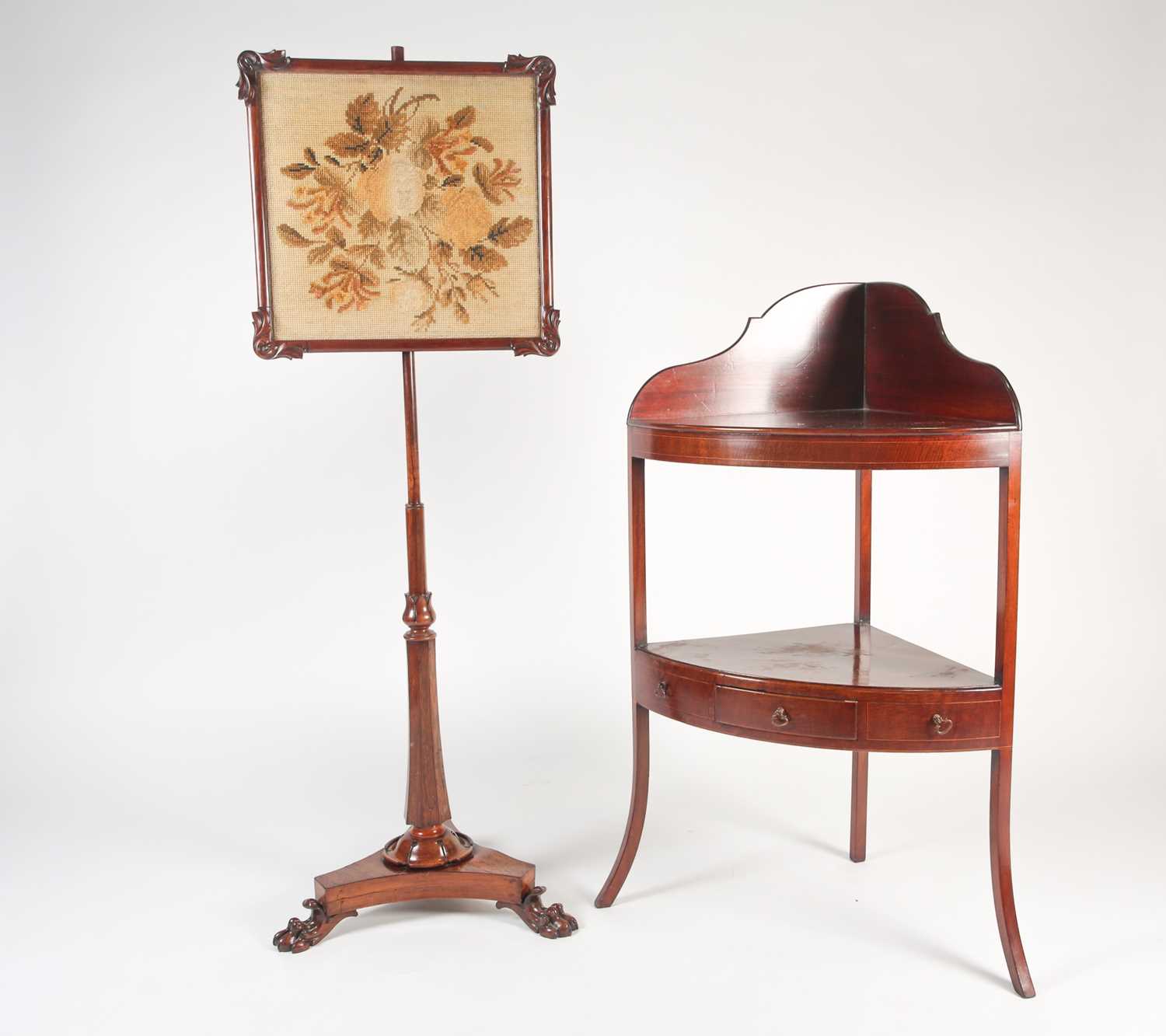 A Geo III mahogany two-tier corner washstand, with shaped upstand splashback a fitted single