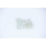 A Chinese carved jade archaic dragon, the stone a uniform colour throughout, 7cm long, 5.5cm