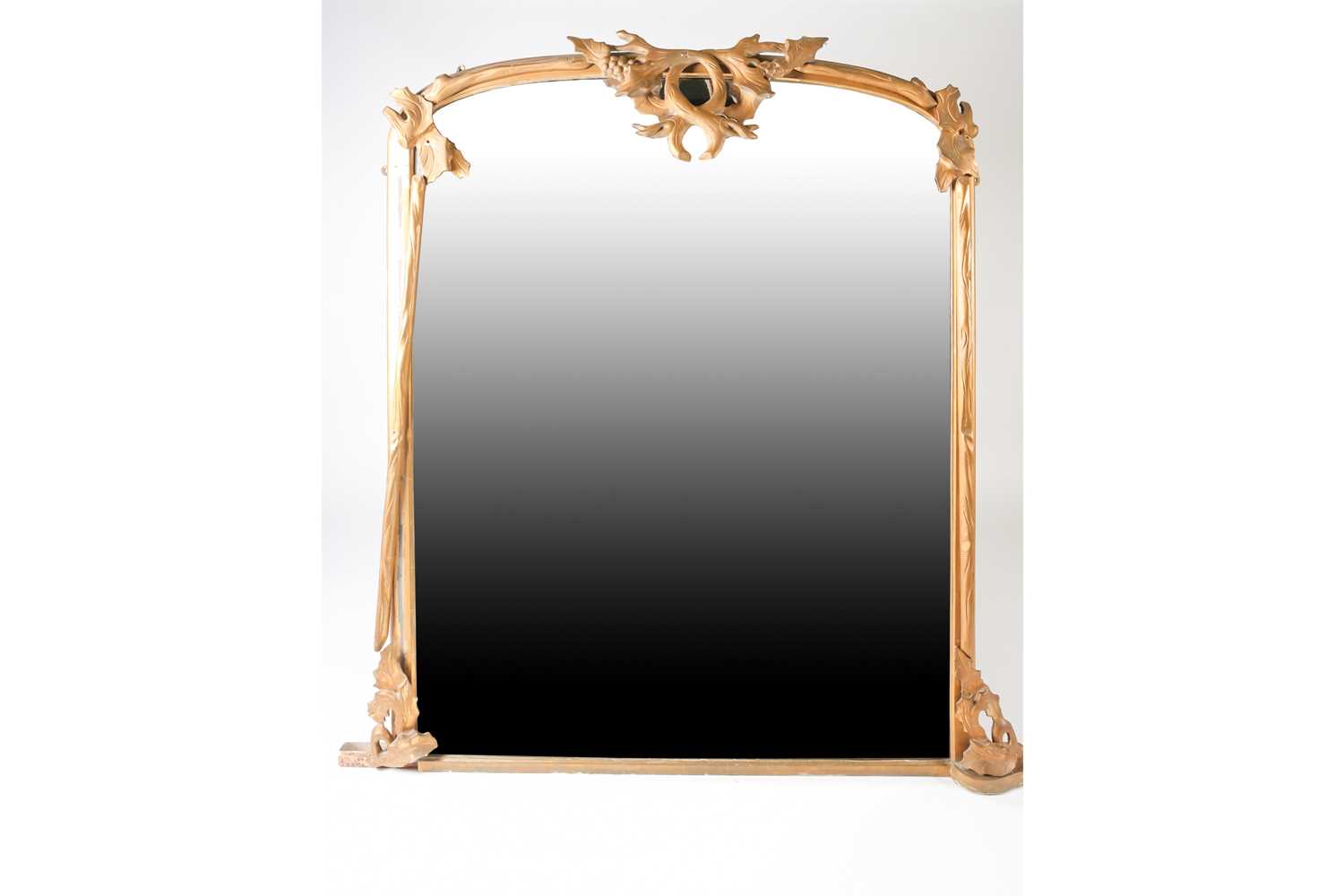 A large late 19th century gilt-framed overmantle mirror, with leaf and berry applied mounts,126cm