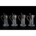 A set of four Victorian silver plate-mounted cut-glass claret-jugs, circa 1890, each with hobnail