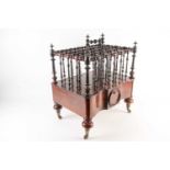 An unusual 19th century figured rosewood Canterbury with bobbin and spindle turned superstructure