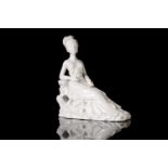 A 20th century Chinese Blanc De Chine, porcelain figure of a lady reclining on a rocky outcrop, in a