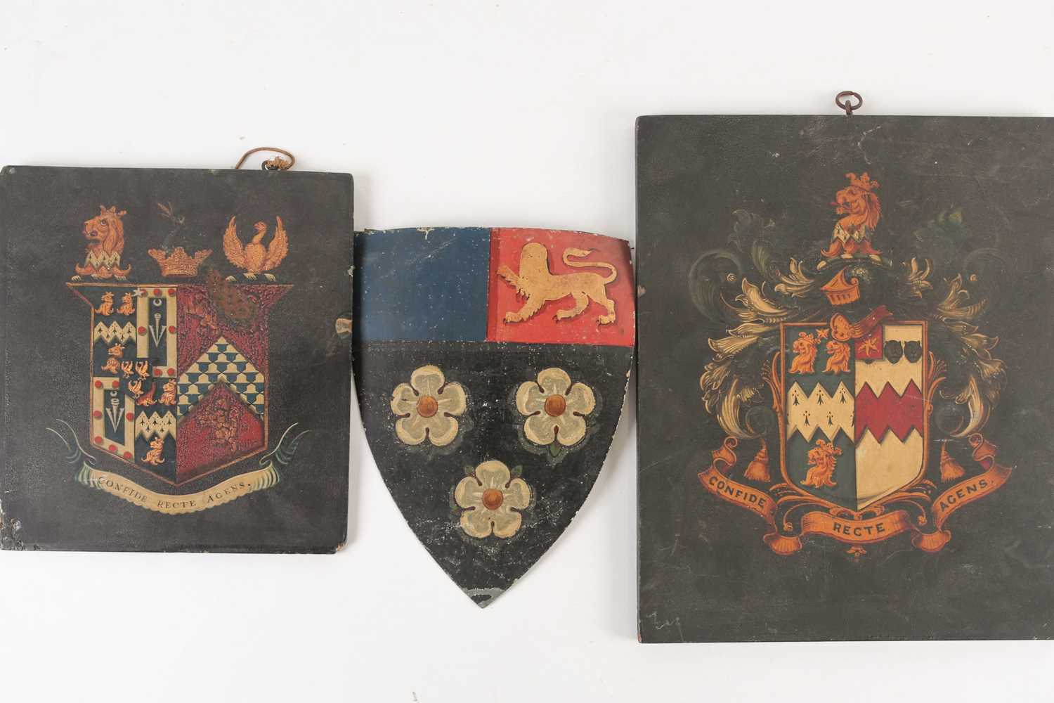 A group of three antique coach/carriage plaques, coats of arms, the largest 30.5 cm x 25 cm.