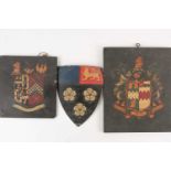 A group of three antique coach/carriage plaques, coats of arms, the largest 30.5 cm x 25 cm.