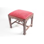 A Chinese Chippendale style carved mahogany, rectangular stool with blind fret chinoiserie