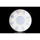 A Chinese, Qing dynasty blue and white porcelain, shallow circular dish painted with a central panel