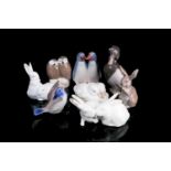 A collection of eight Royal Copenhagen animals, assorted rabbits and birds, the largest 12 cm high.