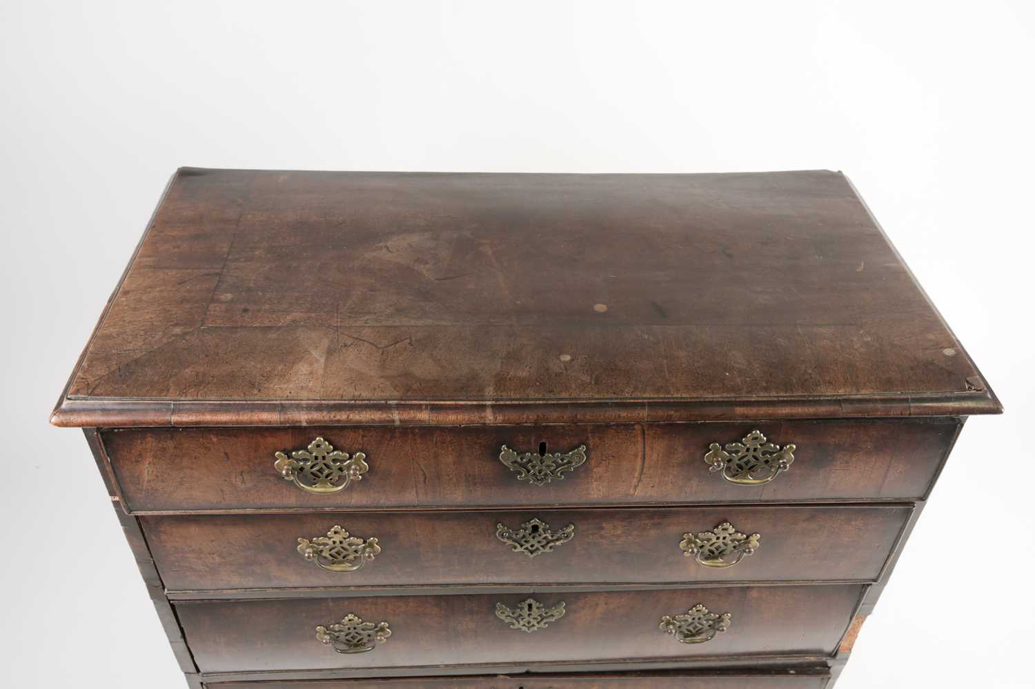 A late George II red walnut veneered chest of drawers, with broad crossbanded top above four - Image 2 of 8