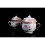 A pair of Chinese, Qianlong, famille rose porcelain, two-handled circular bowls and covers,