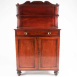 A late Regency mahogany chiffonier with shaped upstand back. The base fitted one long frieze