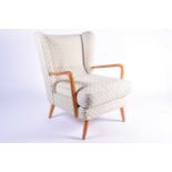 A Howard Keith 'Bambino' open armchair with ivory, patterned stuff over upholstery raises on