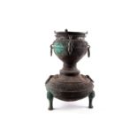 A Chinese bronze Xian, Han Dynasty, the upper section with a fixed dished plate, the interior of