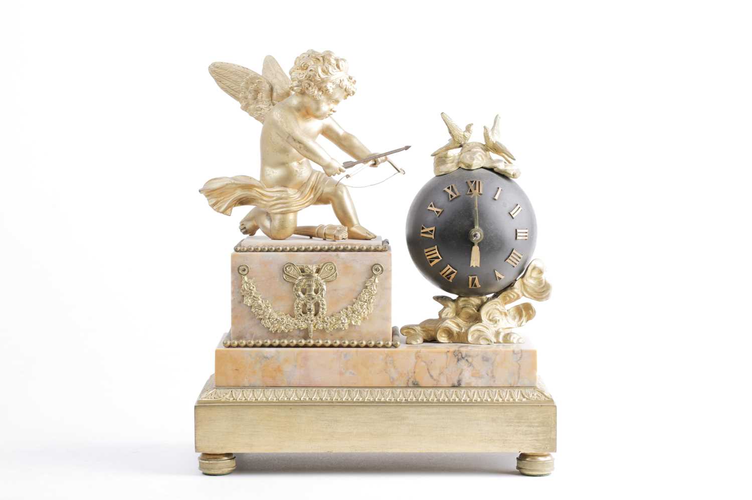 A late 19th century French marble and ormolu mounted mantle clock, mounted with a winged cupid