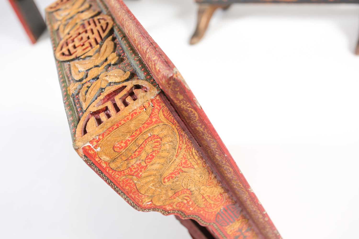 An early 20th Chinese red lacquered folding scribes table with gilt dragons and carved with Shou - Image 2 of 6
