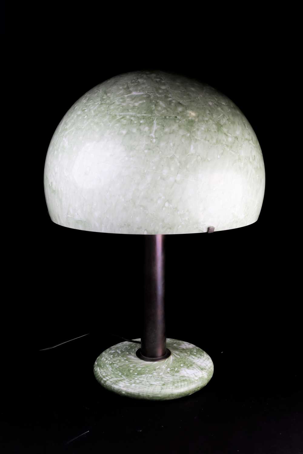 An Italian Modernist style bronze and mottled green glass table lamp, with domed shade, 58 cm high.