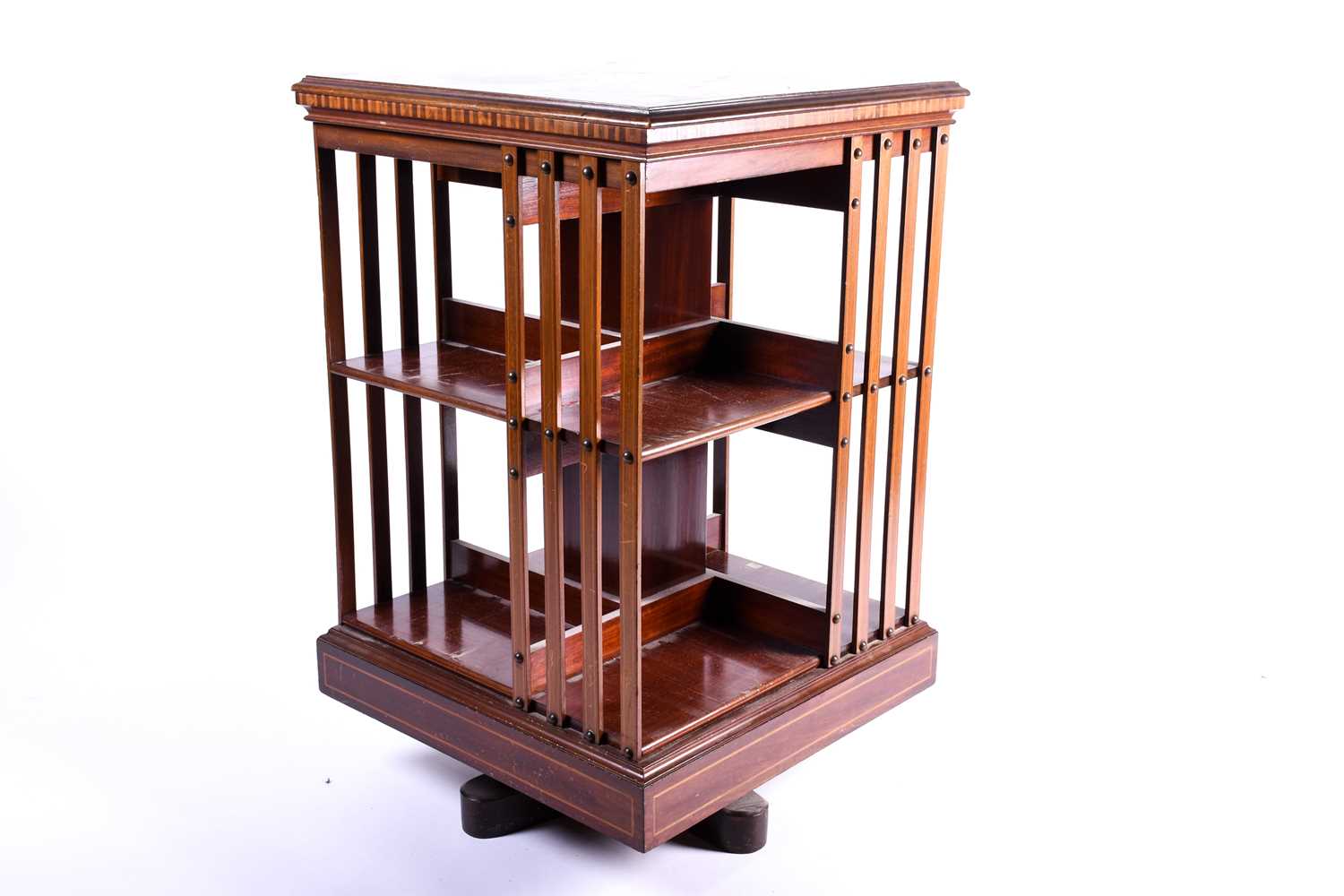 An Edwardian marquetry inlaid mahogany, revolving library bookcase in the manner of Edwards and