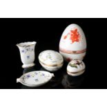 Five pieces of hand-painted Herend porcelain, comprising three boxes formed as eggs, the largest