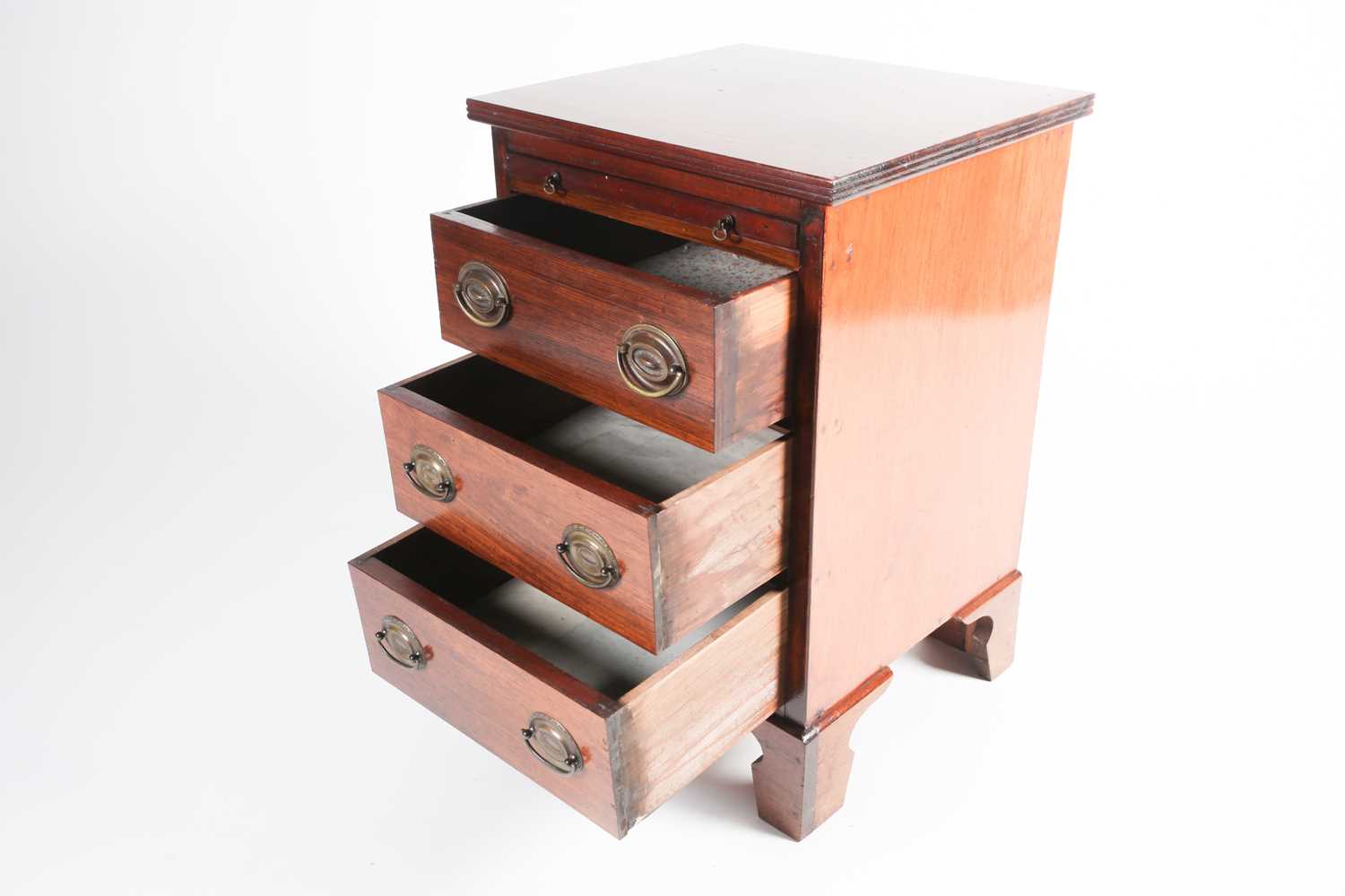 A small Geo III style mahogany chest of three short drawers with brushing slide above. Raised on - Image 3 of 6