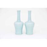 A pair of Chinese celadon mallet shape vases, each with a slightly flared rim on a slender neck