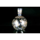 A circa 1900 clear glass bottle vase, of globular form with inverted tapering neck, decorated with