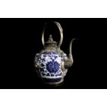 Tibetan white metal mounted blue and porcelain kettle with palmette decoration and dog of fo